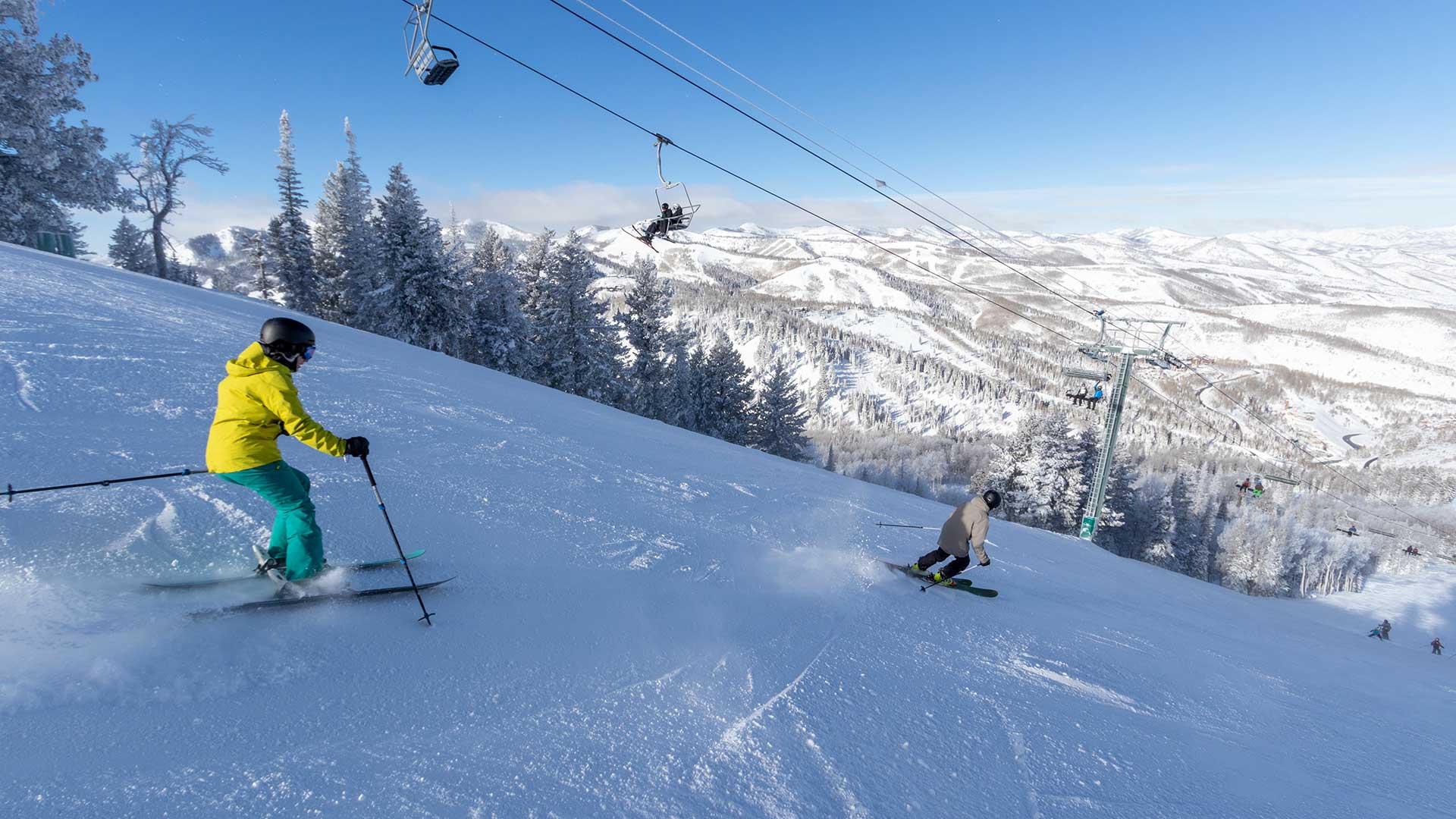Jans Experts skiing on a groomed run next to the chairlift at Deer Valley Resort , Park City, Utah.