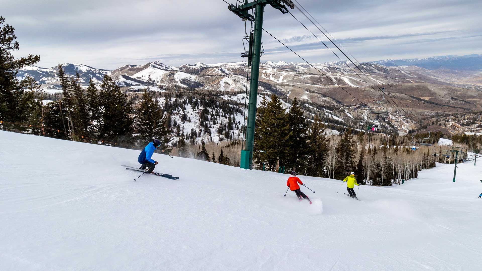 Jans Experts skiing on a groomed run next to the chairlift at Deer Valley Resort, Park City, Utah.