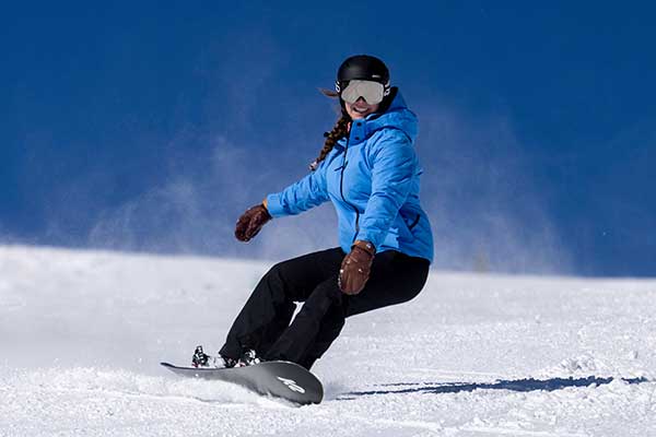 Jans Expert snowboarding on a run at Solitude Resort, Park City, Utah.
