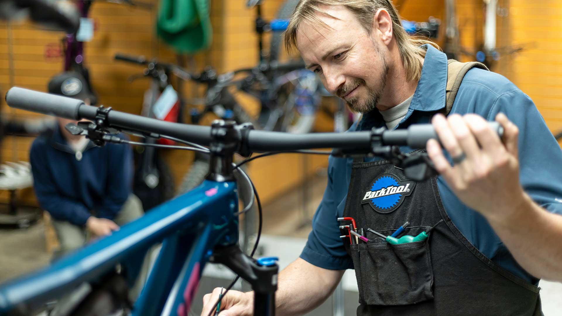 Jans Expert working on tuning a mountain bike at Jans Park Avenue location in Park City, Utah.