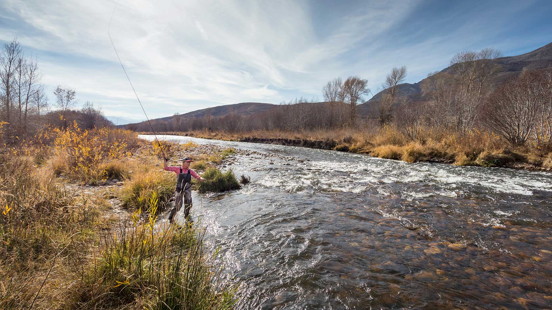 Jans Expert casting while leading a guided fly fishing trip near Park City, Utah.