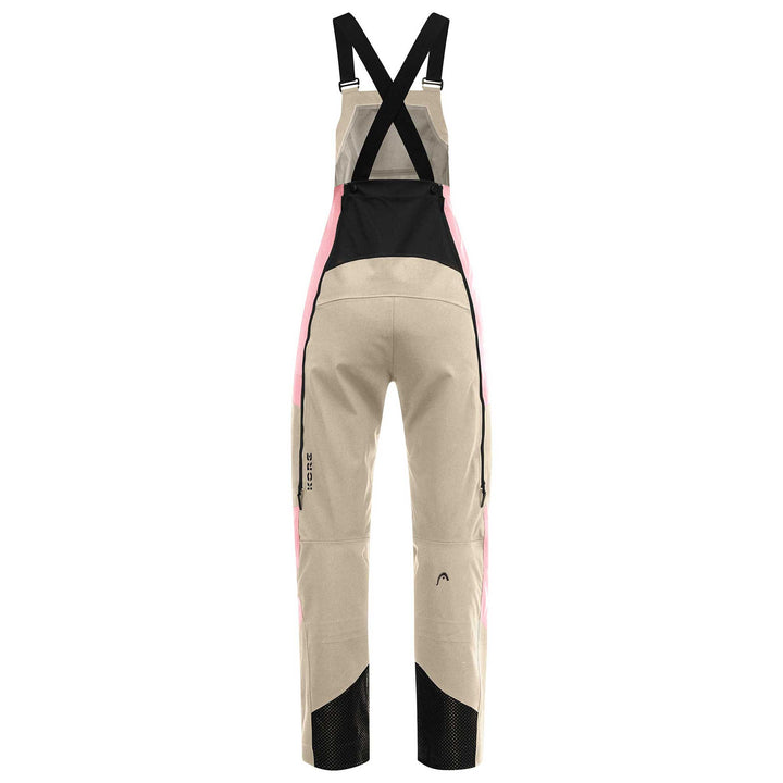 Women’s Head Kore Bib Pant in cream rose, featuring a technical design for cold-weather freeride skiing with full coverage and adjustable fit.