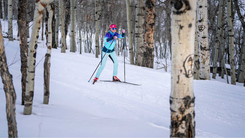 White Pine Touring Nordic Center coach skate skiing in Park City through an Aspen grove. 