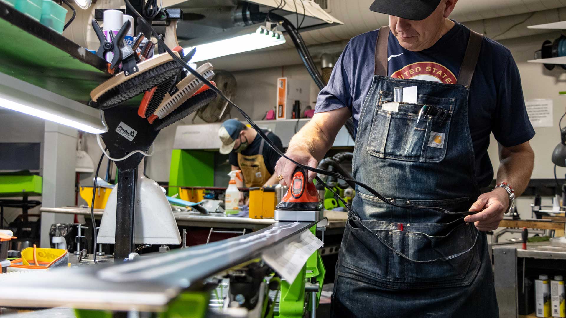 Rennstall Manager, Andy Buckley waxing a ski at the Rennstall Tech Center in Park City, Utah.