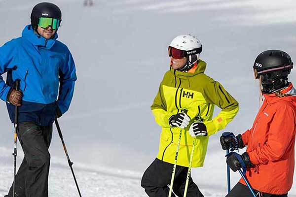Jans experts talking on the side of a run while skiing at Deer Valley Resort, Park City, Utah.