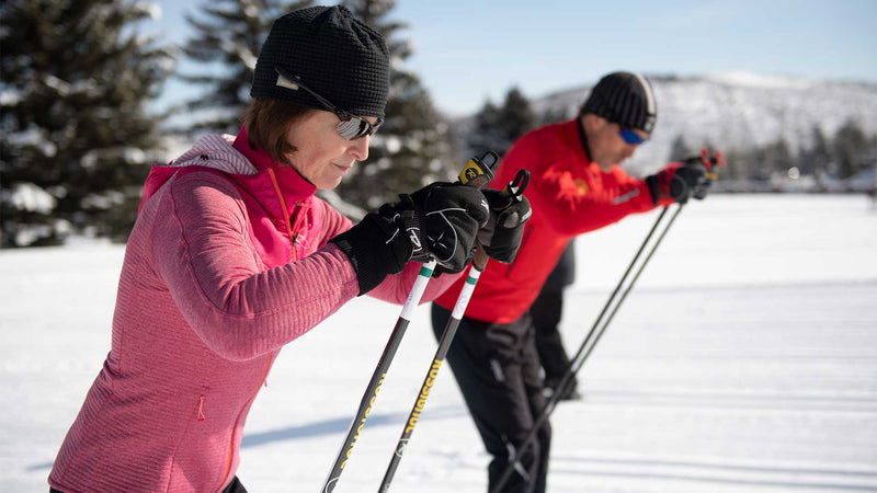 Two people take a skate lesson at the White Pine Touring Nordic Center track in Park City, Utah. 