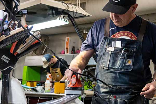 Jans Expert and Rennstall Manager, Andy Buckley waxing skis at the Rennstall Tech Center.